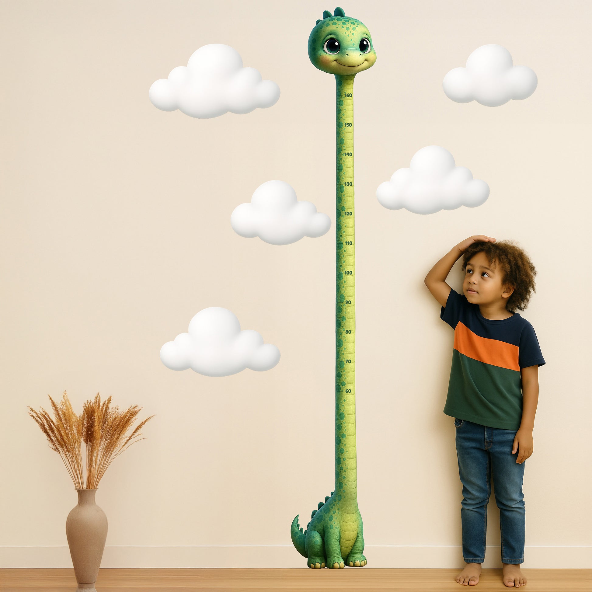 Cute dinosaur height chart sticker with a smiling green cartoon dino stretching up to 190 cm, white fluffy cloud stickers shown beside a young child measuring their height against the wall.
